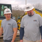 Two Lantz workers walking and smiling together on a site
